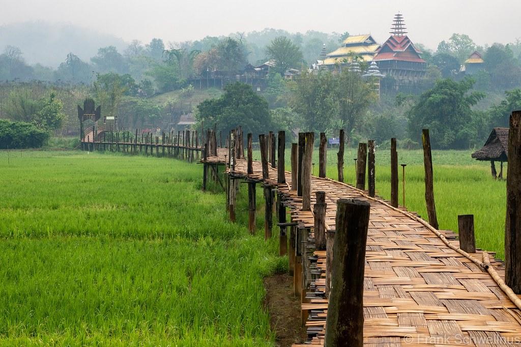 Historic Su Tong Pae woven bamboo bridge crossing green rice paddies in Mae Hong Son